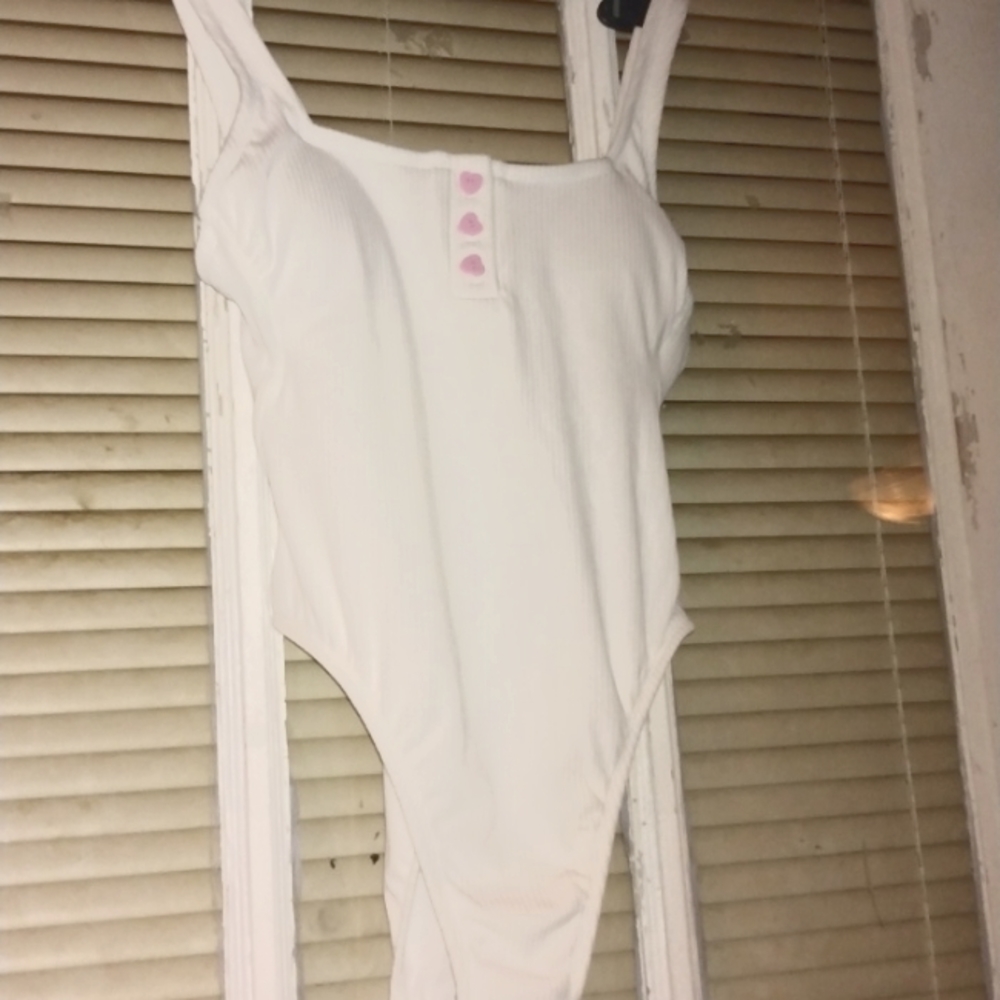 One piece bathing suit sizexS. It is cut high on the thigh.